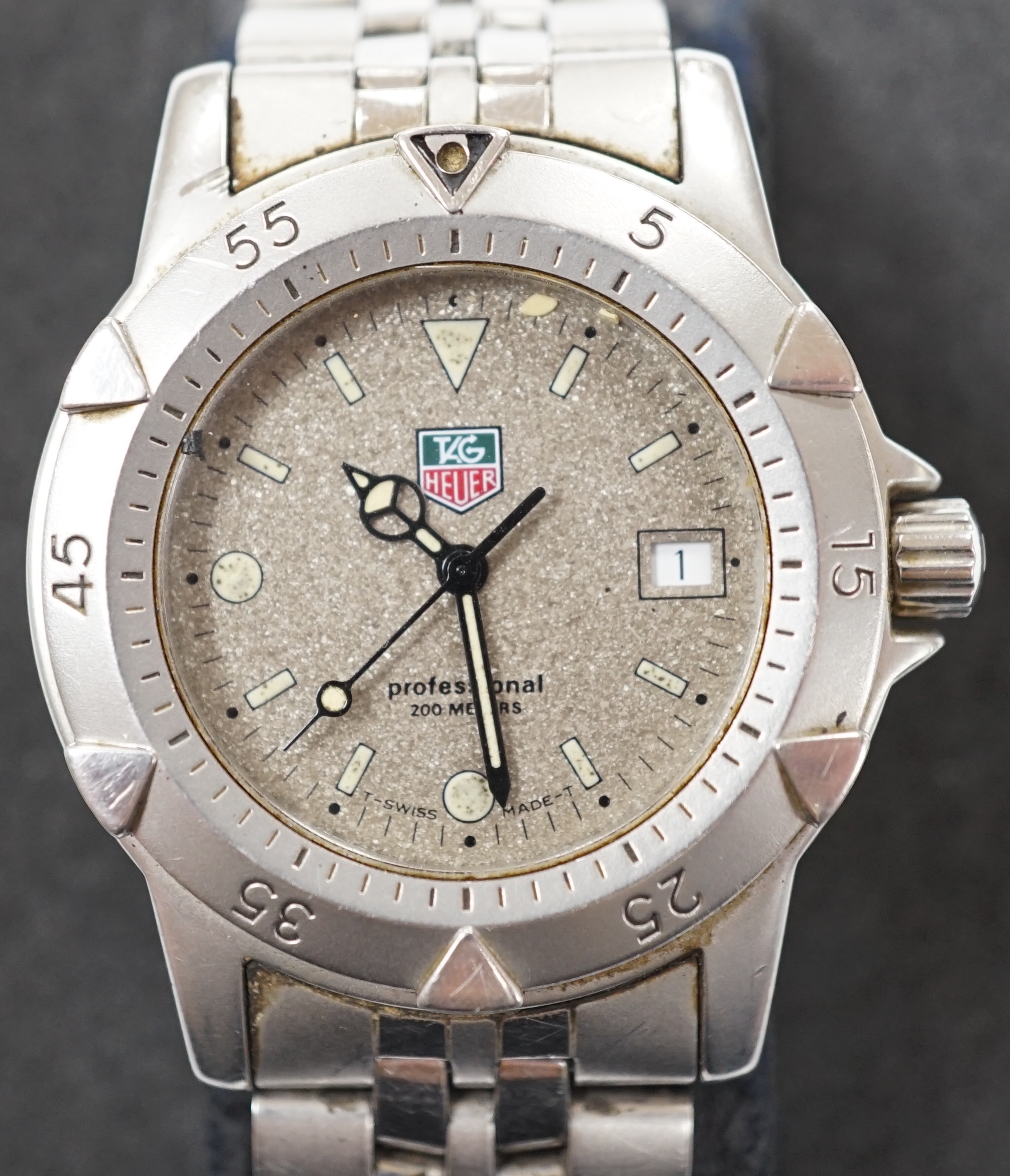 A gentleman's stainless steel Tag Heuer Professional quartz wrist watch, WD 1211-K-20, with box, instructions and guarantee.